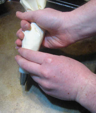 Guide the bag with the other hand.