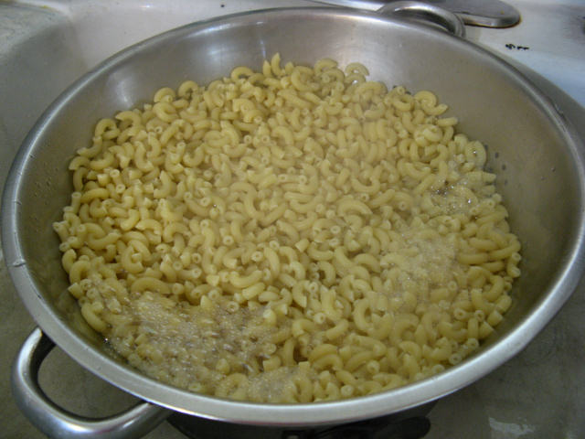 strainer full of pasta